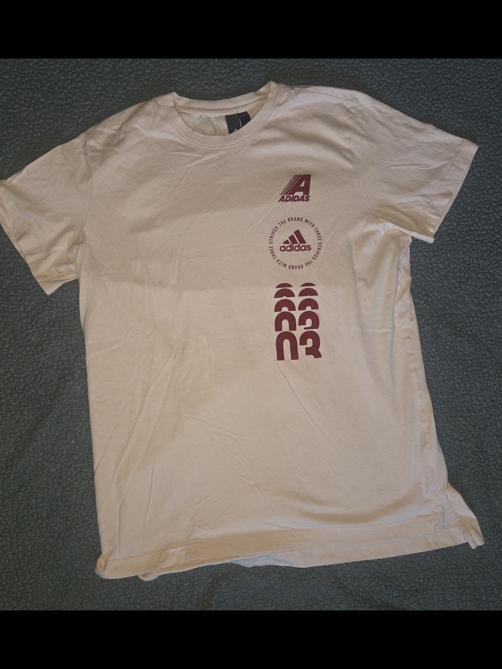 Mens Adidas Off-White Tee with Maroon Logo Design.